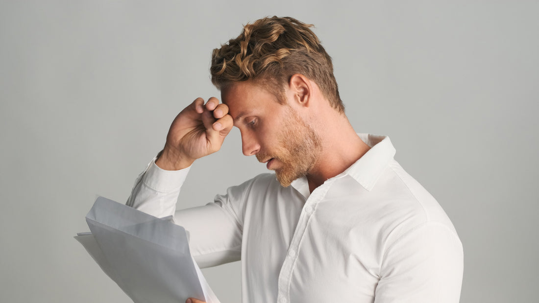 A person struggling to read eyewear prescription